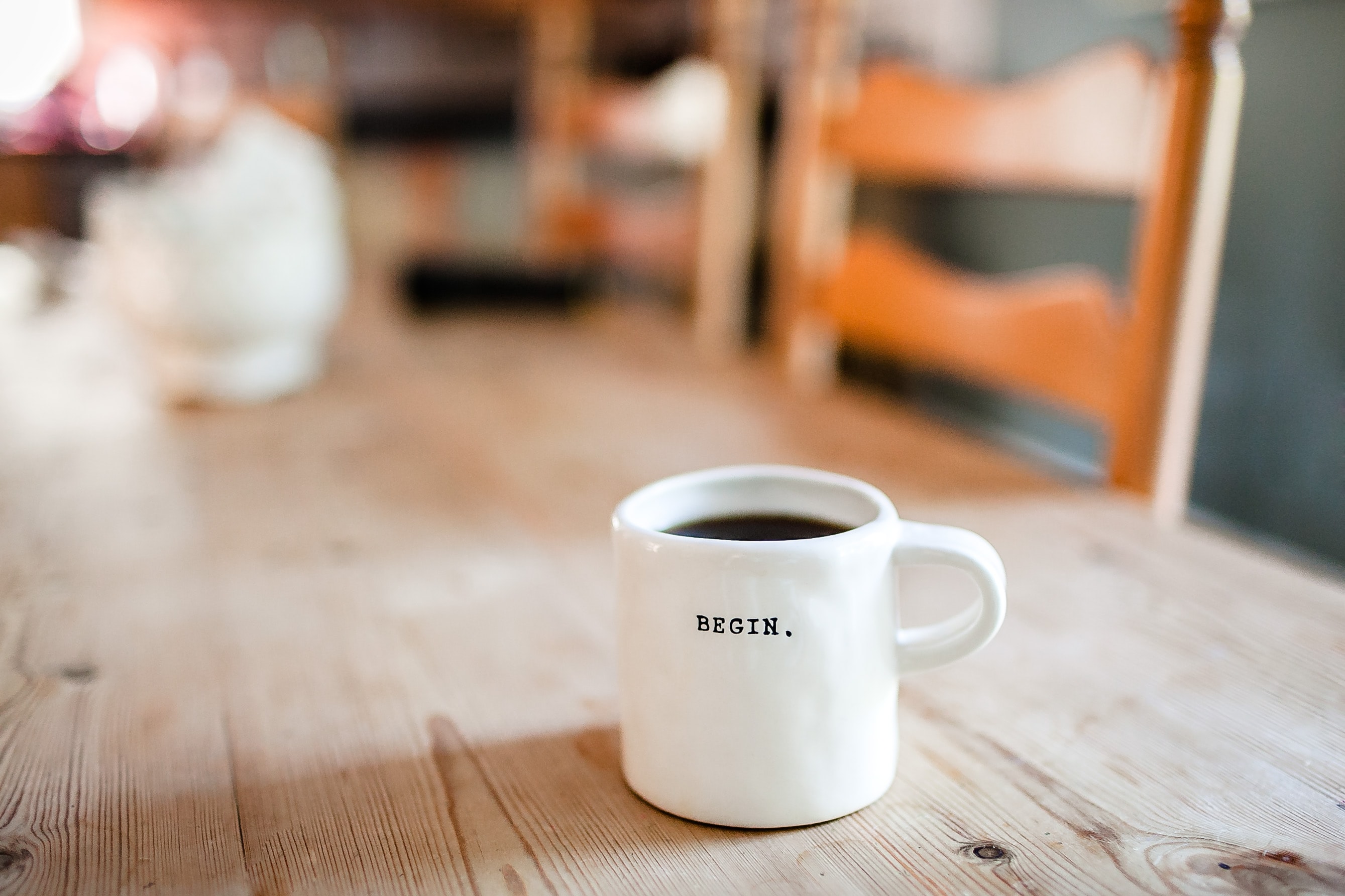 Leadership header image coffee mug with 'begin' written upon it